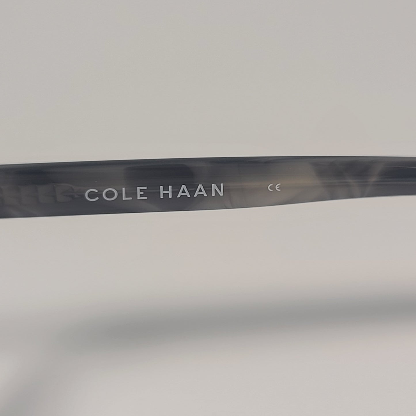 Cole Haan CH7044 001 Cat Eye Sunglasses Black Gray Frame Gray Mirror Lens 57mm