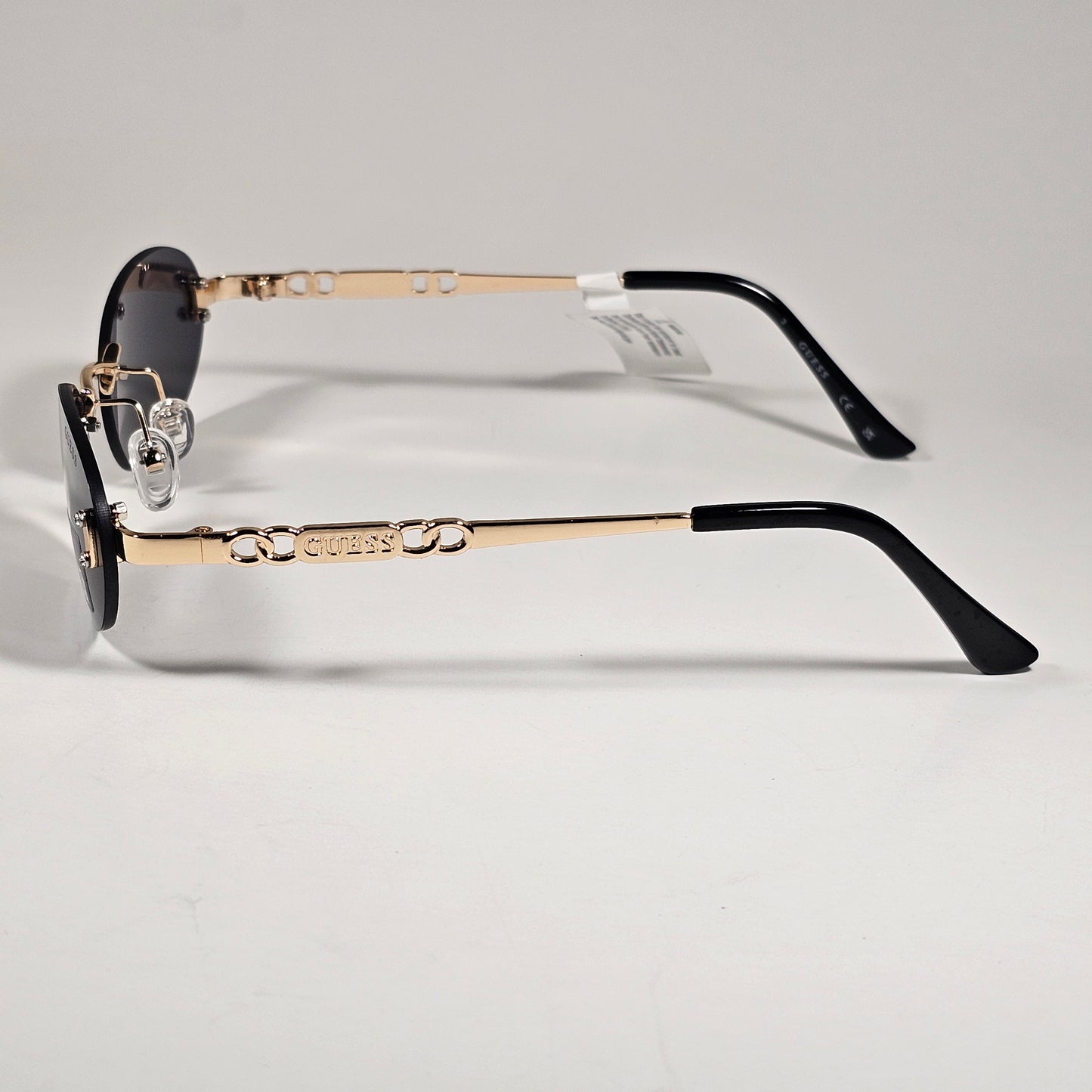 Guess GO00082 32A Small Rimless Oval Sunglasses Gold Frame Gray  Tinted Lens