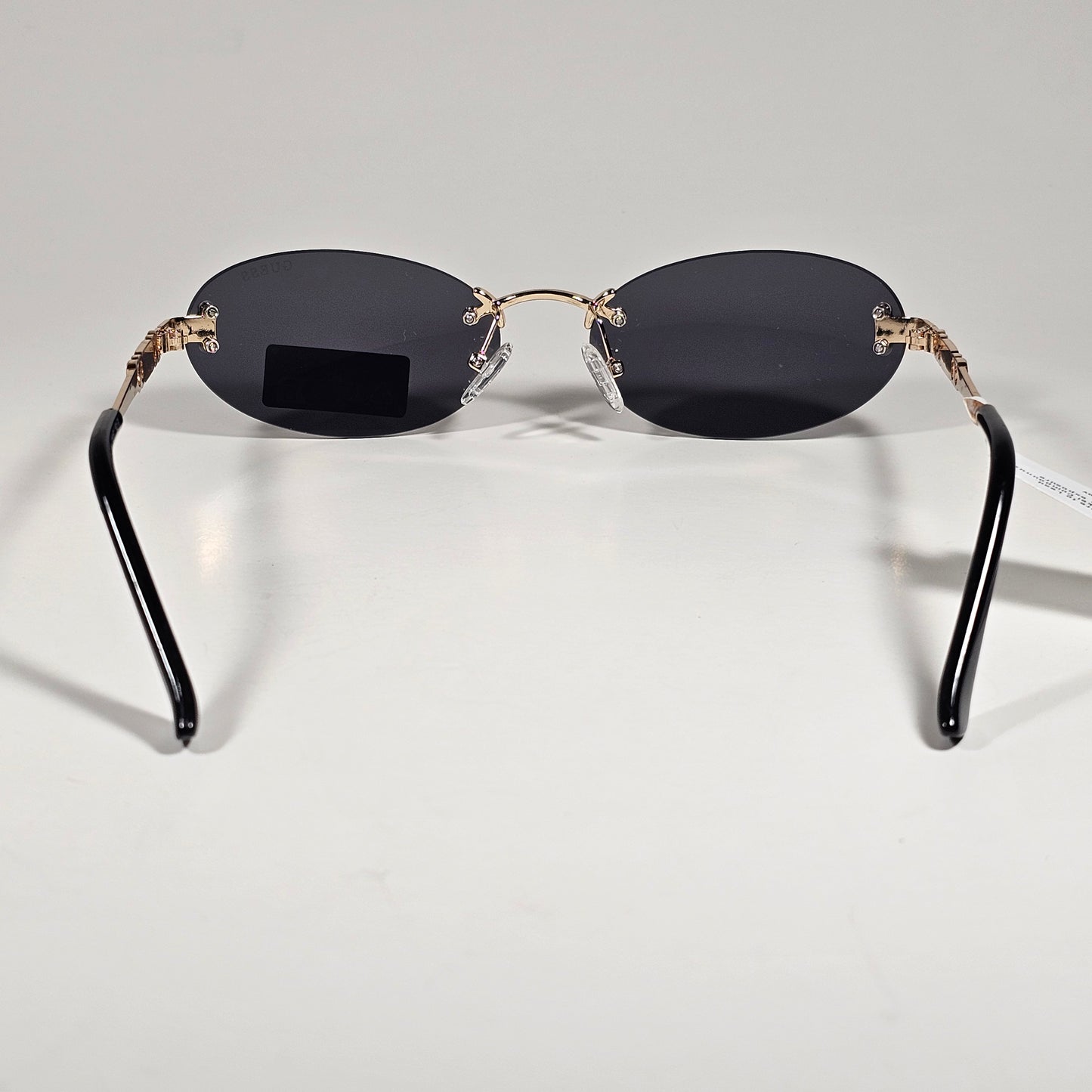 Guess GO00082 32A Small Rimless Oval Sunglasses Gold Frame Gray  Tinted Lens