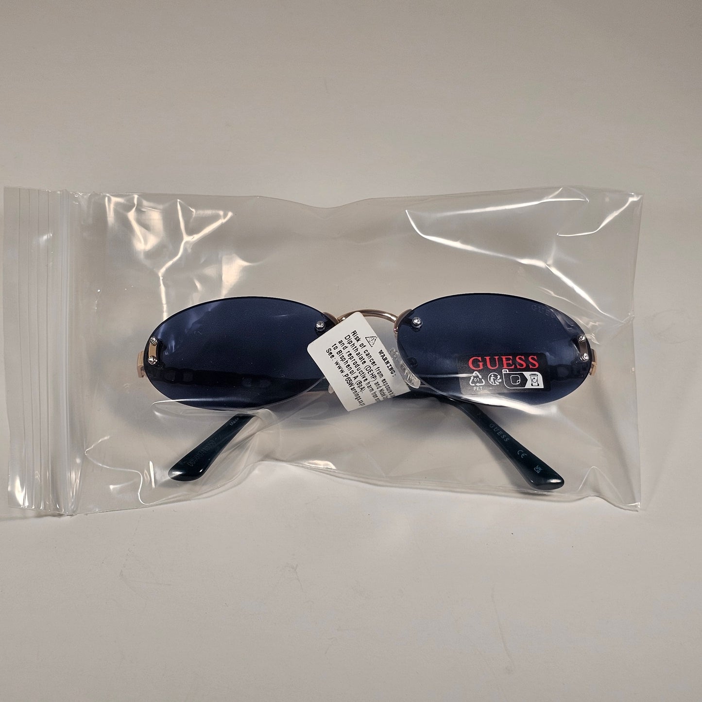 Guess GO00082 32A Small Rimless Oval Sunglasses Gold Frame Blue Tinted Lens 60mm