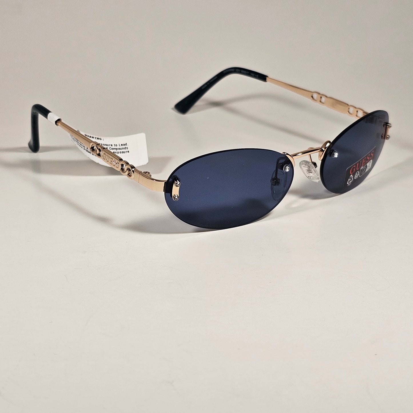 Guess GO00082 32A Small Rimless Oval Sunglasses Gold Frame Blue Tinted Lens 60mm