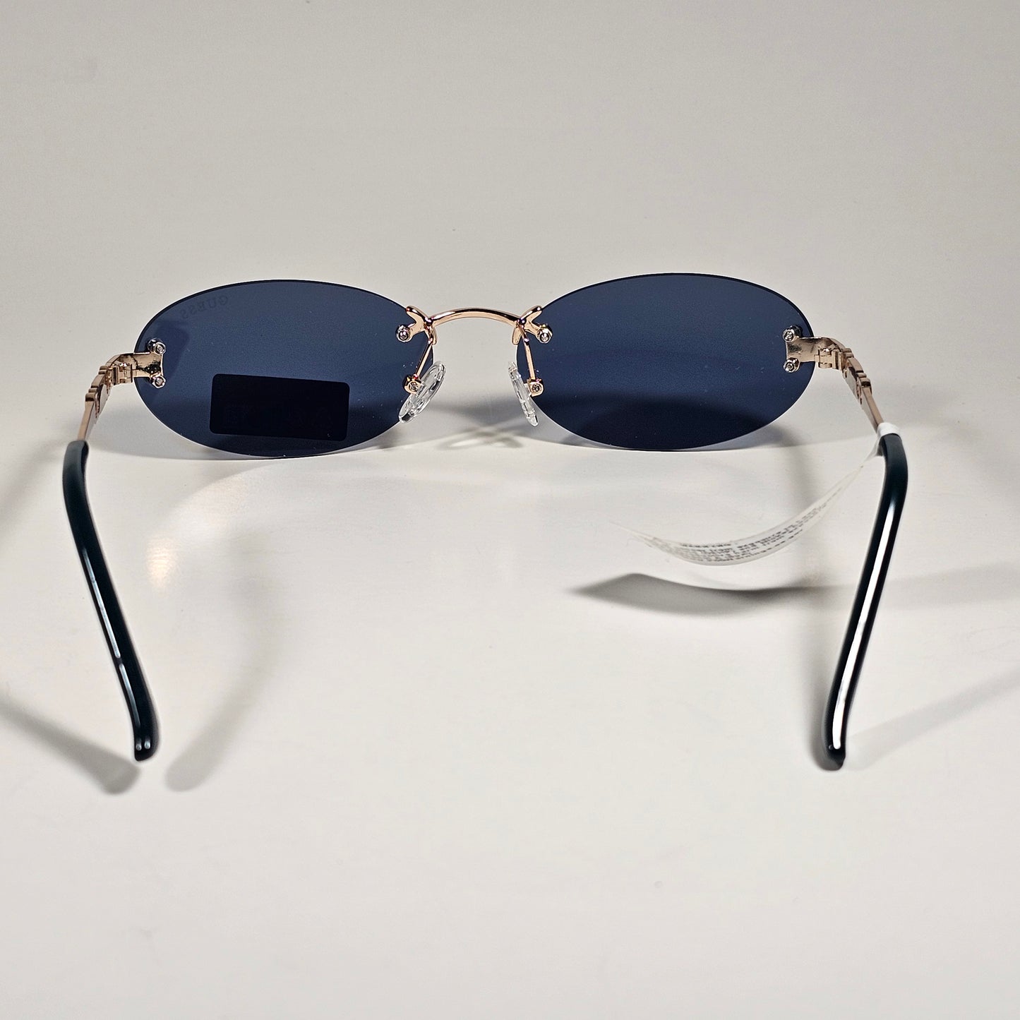 Guess GO00082 32A Small Rimless Oval Sunglasses Gold Frame Blue Tinted Lens 60mm