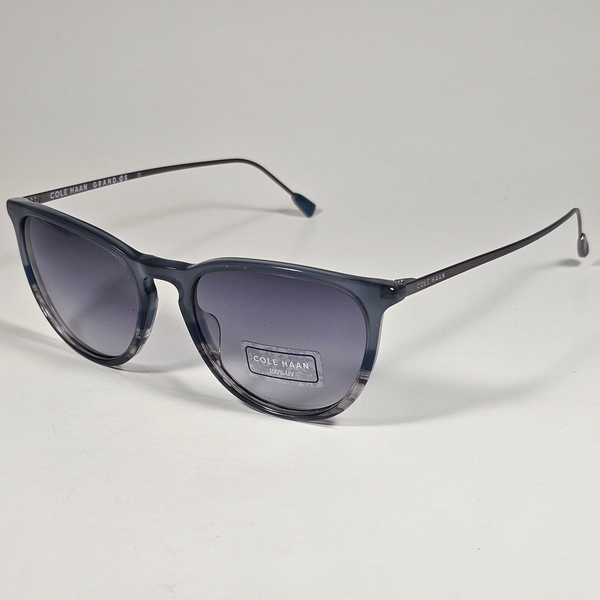 Cole Haan CH3001 036 Key Hole Ti-Flex Sunglasses Gray Smoke Horn Gray Gradient
