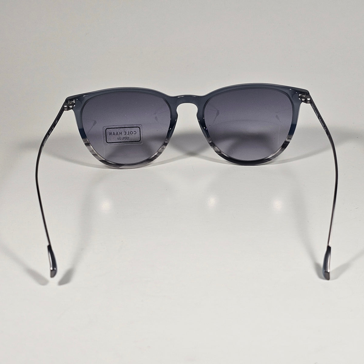 Cole Haan CH3001 036 Key Hole Ti-Flex Sunglasses Gray Smoke Horn Gray Gradient