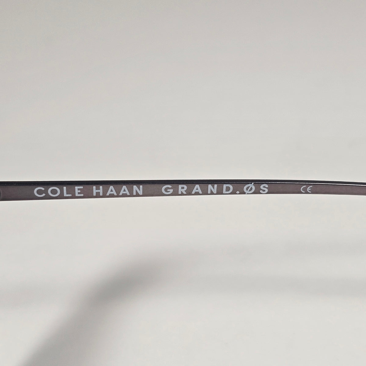 Cole Haan CH3001 036 Key Hole Ti-Flex Sunglasses Gray Smoke Horn Gray Gradient