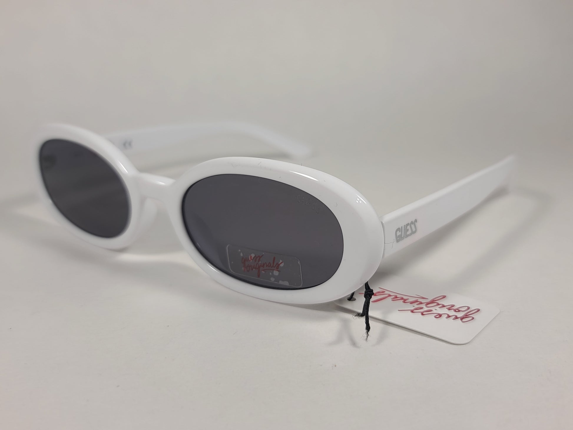 Guess Originals Small Oval Sunglasses White Frame Gray Lens GU8216 21A - Sunglasses